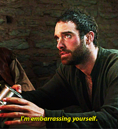 Galavant, a man with short black hair and beard, speaking to someone saying "I'm embarrassing yourself".